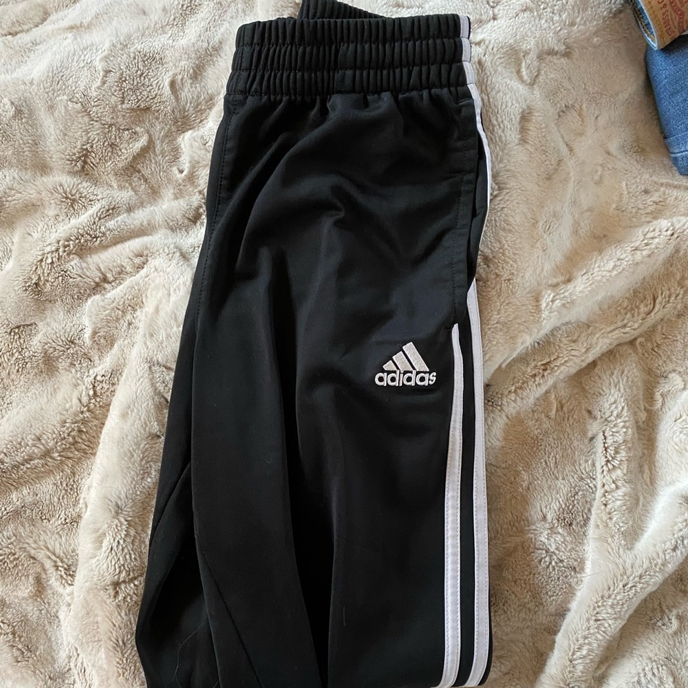 Black and white addias pants